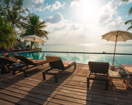 Loungers on a Deck Above a Pool and Sea