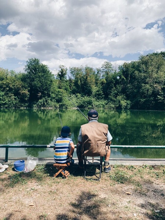 Man and Boy Fishing at a Lakeside
